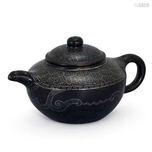 A very rare Yixing lac-burgaute teapot and cover, Qing dynas...