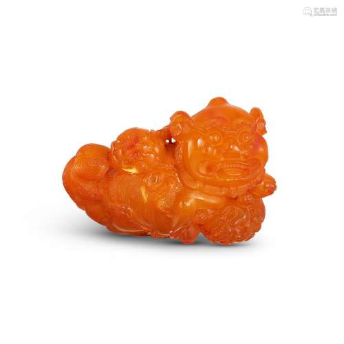 An amber carving of 'Buddhist lion' group, 17th cent...