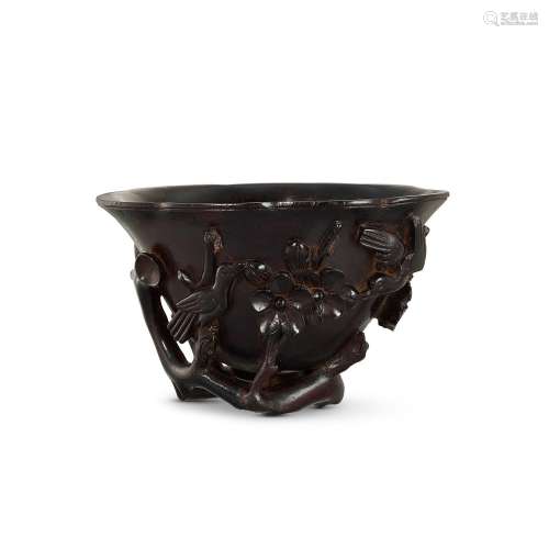 A hardwood carved 'prunus and magpie' libation cup, ...