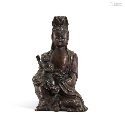 A bronze figure of Guanyin and child, Ming dynasty, 16th cen...