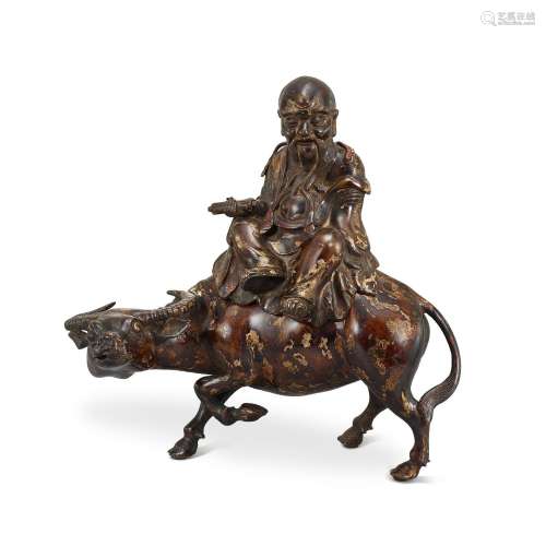 A parcel-gilt bronze figure of Shoulao on a buffalo, 17th ce...