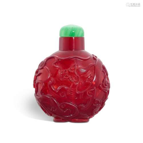 An imperial red glass 'chilong' snuff bottle, Qing d...