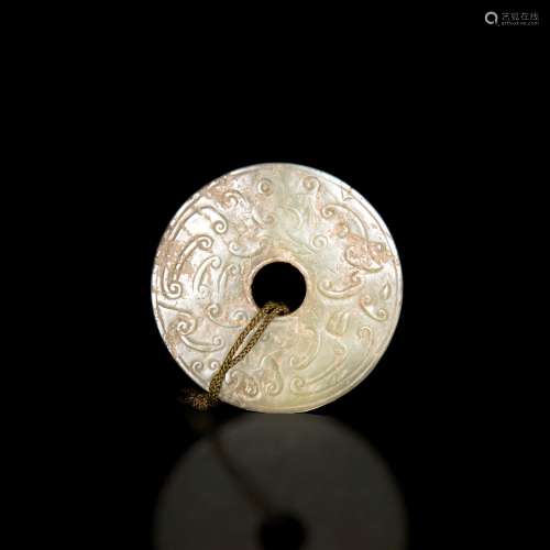 明代或更早 玉雕勾雲紋璧A Chinese carved jade bi,Ming dynasty...