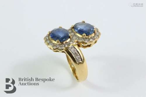 18ct yellow gold sapphire and diamond ring. The ring set wit...