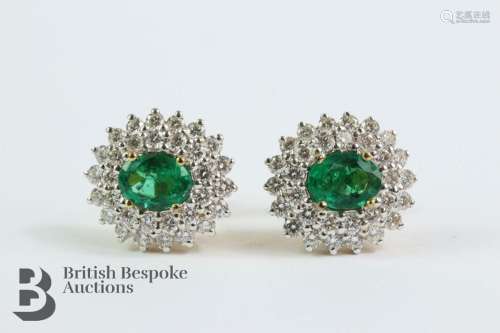 18ct gold and emerald earrings. The earrings set with oval e...