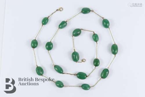 Jade bead necklace. The necklace set with seventeen lozenge-...