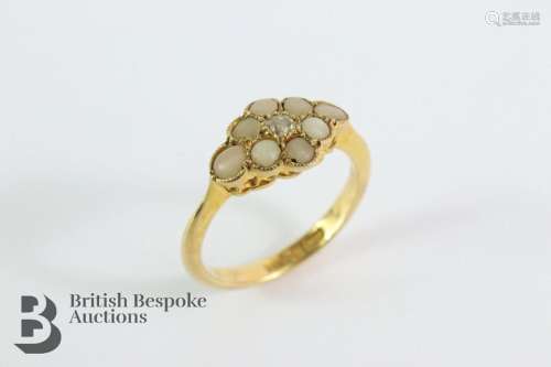 Antique 18ct diamond and pearl ring. The ring set with 8 pea...