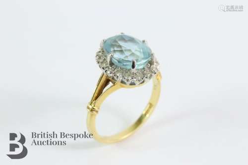 18ct yellow gold aquamarine and diamond ring. The ring set w...