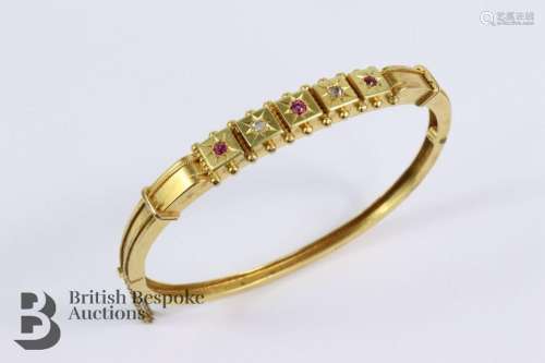 Edwardian 18ct yellow gold diamond and ruby bangle. The bang...