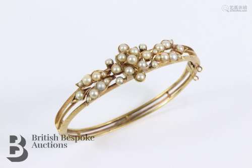 Edwardian 14/15ct gold pearl bangle. The bangle measures 55 ...