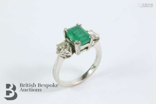 18ct white gold ring. The ring set with a central emerald ap...