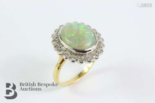 18ct yellow gold opal and diamond cluster ring. The opal mea...