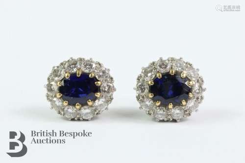 Pair of 18ct white gold sapphire and diamond earrings. The e...