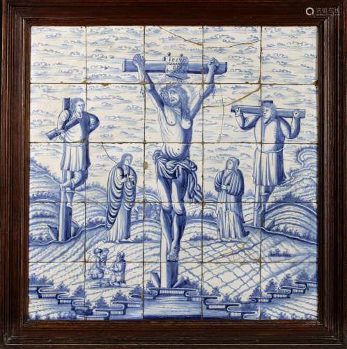 A BLUE AND WHITE DELFT TILE PANEL DEPICTING THE CRUCIFIXION,...