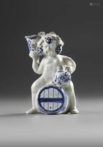 A BLUE AND WHITE BACCHUS ON A WINE BARREL, PROBABLY BRUSSELS...