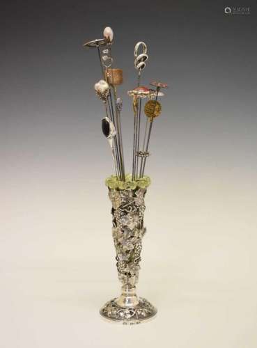 Victorian silver vase with thirteen hat pins