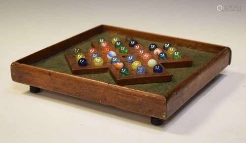 Victorian oak solitaire or Fox and Goose board, and marbles