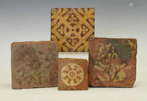 Group of four late Medieval encaustic tiles