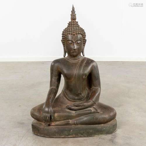 A large figurine of a seated buddha, patinated bronze. Thail...