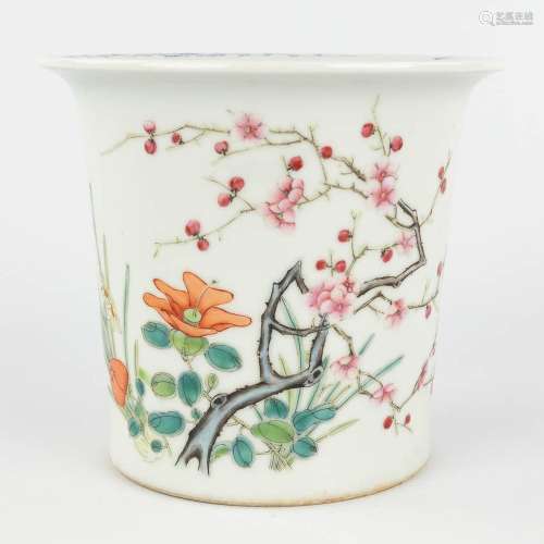 A Chinese porcelain cache-pot decorated with flowers and bra...