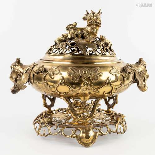 A large insence burner, polished bronze decorated with mytho...