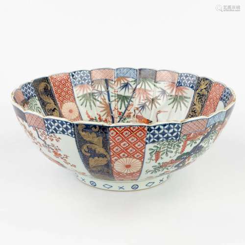 A large Oriental bowl, Imari decorated with cranes and flowe...