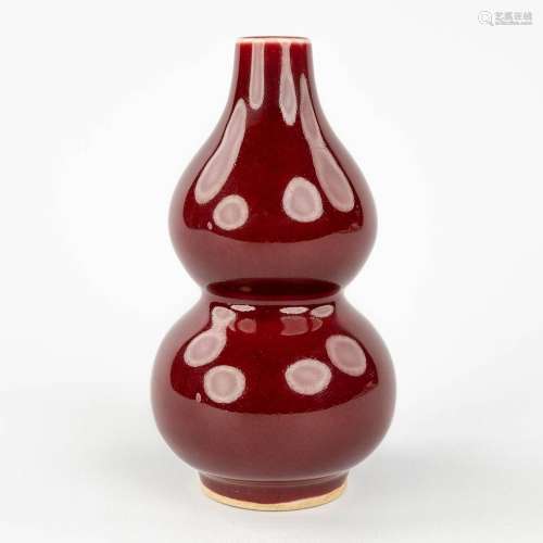 A Chinese double gourd vase, Sang De Boeuf glaze, 19th/20th ...