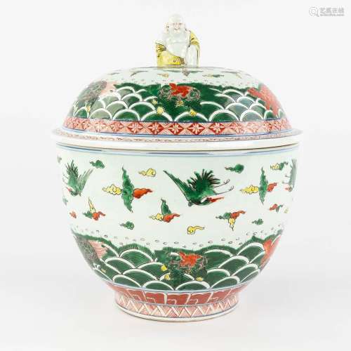 A Chinese Famille Verte pot with a lid, decorated with crane...
