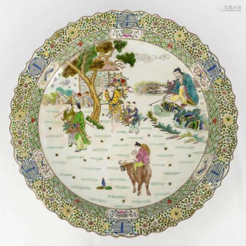 A Chinese plate 'Famille Verte' decorated with Chinese figur...