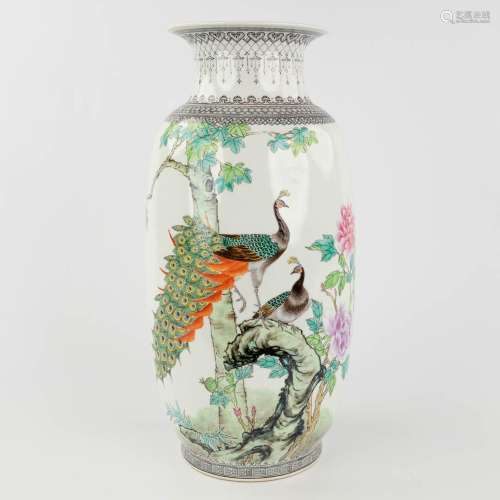 A Chinese vase decorated with peacocks, 20th century. (H: 42...