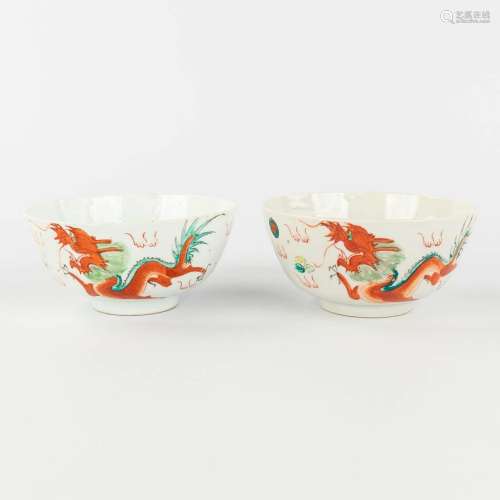 A pair of Chinese bowls decorated with dragons and phoenixes...