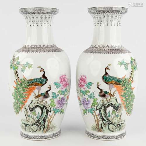 A pair of Chinese vases decorated with hand-painted peacocks...