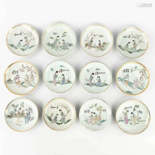 A set of 12 Chinese Famille rose display plates, decorated w...