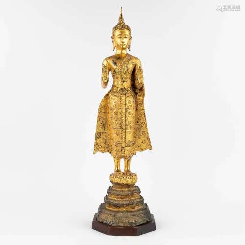 A Thai buddha, gilt bronze on a wood base. (L: 19 x W: 19 x ...