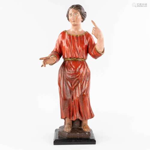 An antique wood-sculptured and polychrome figurine of a nobl...