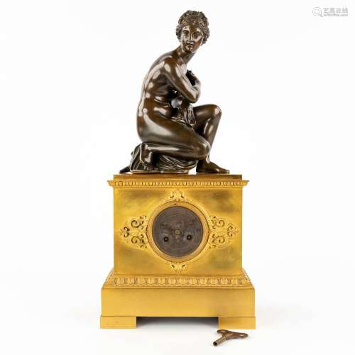An antique mantle clock 'Lady seated on a tortoise'. Empire ...