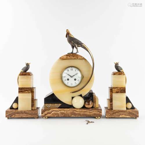A three piece mantle garniture clock and side pieces, onyx a...