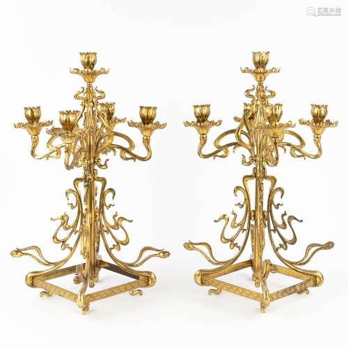A pair of candelabra, brass in art nouveau periode. Circa 19...