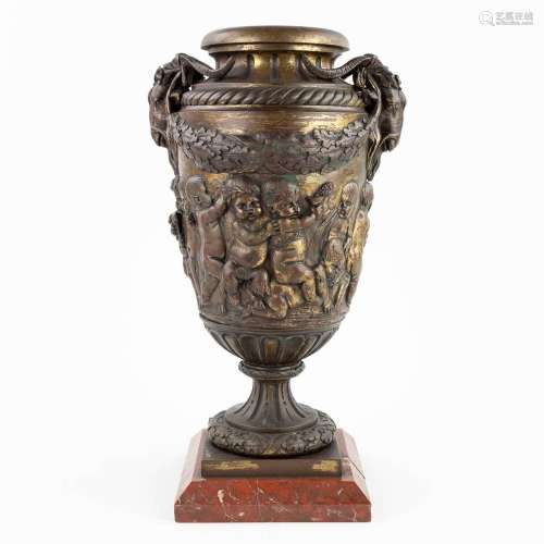 A large vase, bronze decorated with playing children. 19th c...