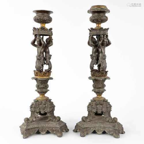 A pair of candlesticks decorated with Karyatids. Spelter and...