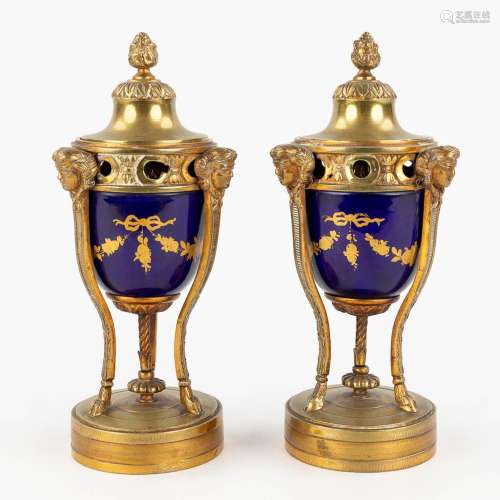 A pair of reversible cassolettes and candlesticks, Sèvres po...