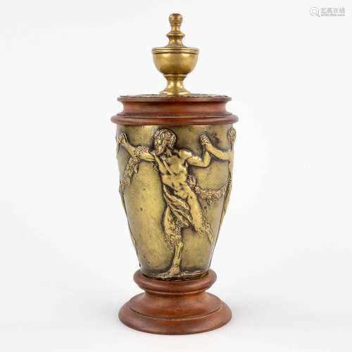 An antique bronze ornament, decorated with a dancing Satyr a...