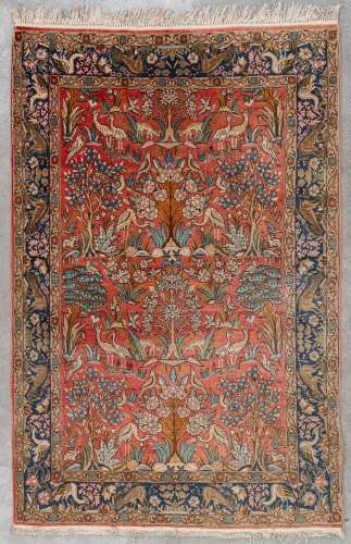 An Oriental hand-made carpet, figurative decor with tree of ...
