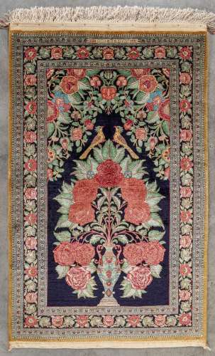An Oriental hand-made carpet, silk, Ghoum. (L: 128 x W: 84 c...