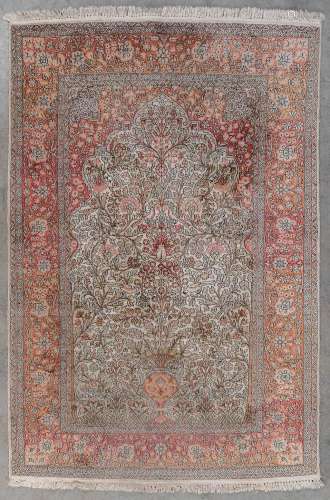 An Oriental hand-made carpet. Flower Vase, Kashan. (L: 223 x...
