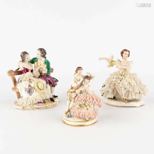 A collection of 3 porcelain figurines with porcelain lace dr...