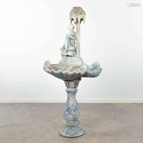 A fountain, made of glazed ceramics and finished with angels...