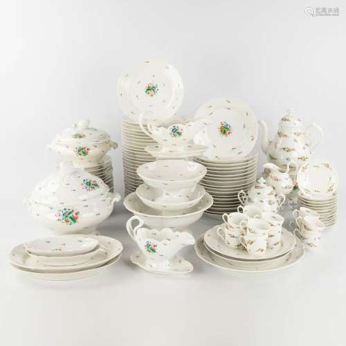 An antique and large porcelain dinner service, hand-painted ...