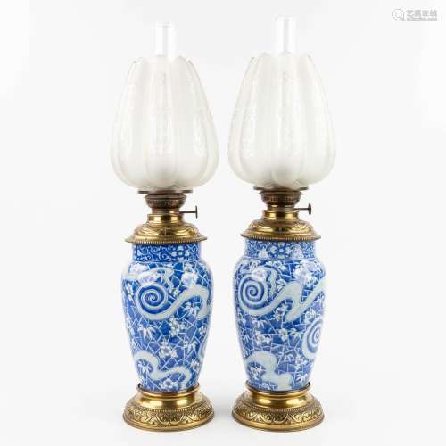 A pair of antique oil lamps, ceramic, glass and brass. (W: 1...