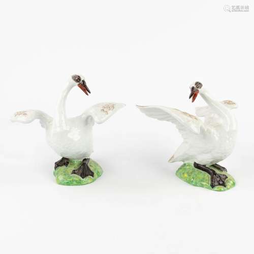 A pair of swans, porcelain with hand-painted decor, probably...